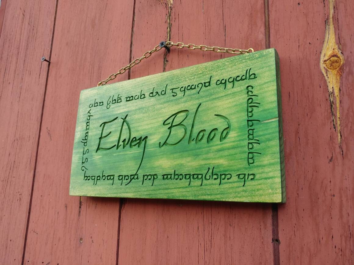 Elven Blood, carved elf sign with sindarin inscription.