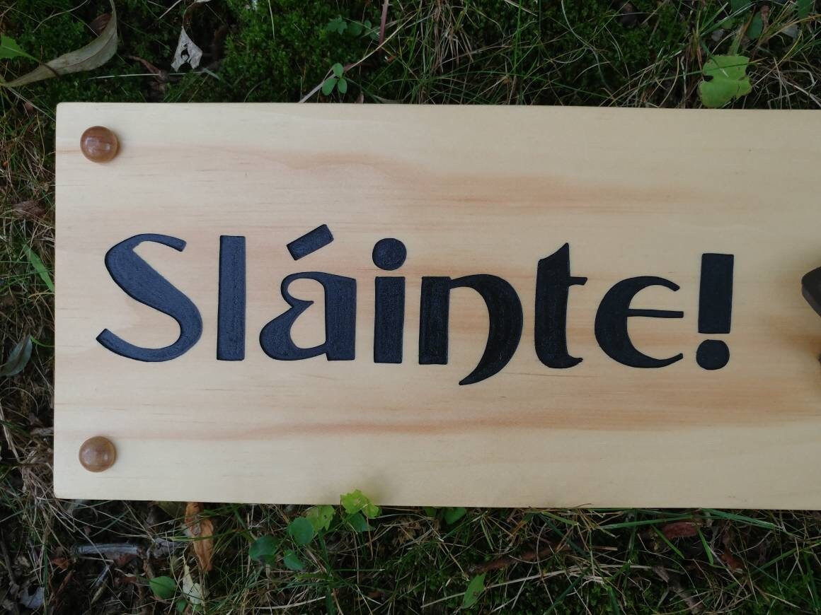 Slainte, carved irish bottle opener cheers sign